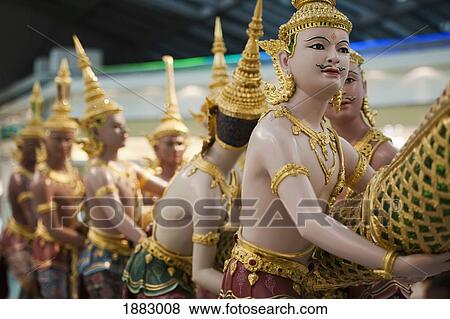 Stock Photo - Angel Statues Pull On A Dragon's Tail From Thai Mythology; Chiang Mai, Thailand. Fotosearch