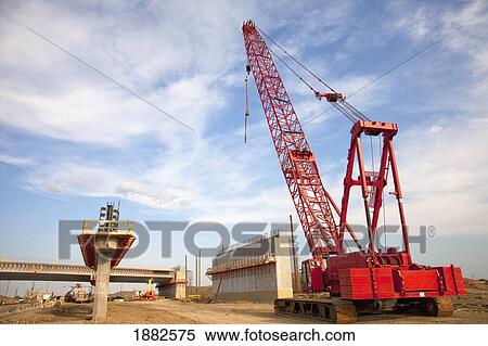 Bridge Construction Using A Crane; Edmonton, Alberta, Canada View Large Photo Image Stock Photography - Bridge Construction Using A Crane; Edmonton, Alberta, Canada. Fotosearch