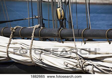 Close Up Of A Tall Ship's Sail And Pulley; Port Colborne, Ontario, Canada View Large Photo Image Stock Photography - Close Up Of A Tall Ship's Sail And Pulley; Port Colborne, Ontario, Canada. Fotosearch