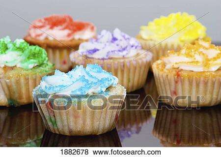 Stock Photo - Cupcakes Decorated With Various Colored Sprinkles. Fotosearch