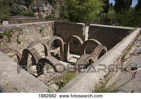 Stock Image - Entrance To The Covered Chambers Of The Arab Baths; Ronda, Andalusia, Spain. Fotosearch