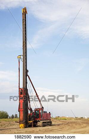 Stock Image - Infrastructure Using A Pile Driver; Edmonton, Alberta, Canada. Fotosearch