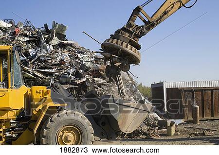 Stock Image - Items Being Pulled Off A Pile Of Materials For Recycling; Adamsville, Quebec, Canada. Fotosearch