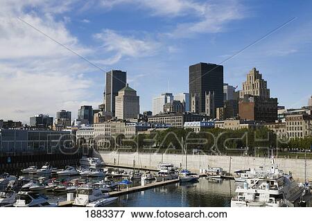 Montreal Skyline And Old Port Along The Harbour; Montreal, Quebec, Canada View Large Photo Image Stock Photo - Montreal Skyline And Old Port Along The Harbour; Montreal, Quebec, Canada. Fotosearch