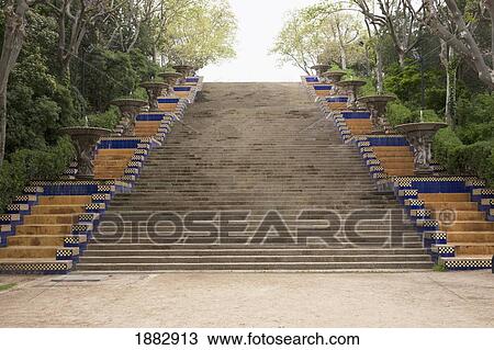 Stock Image - Mosaic Lined Steps With Fountains; Barcelona, Spain. Fotosearch