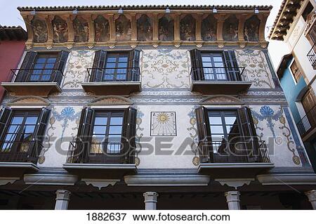 Stock Photo - Neoclassical-Style Mural Paintings On The Side Of A Building In Coreche Square; Graus, Huesca, Spain. Fotosearch