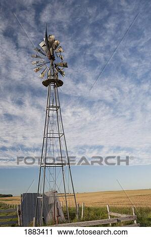 Old Wind Mill Beside A Field; Alberta, Canada View Large Photo Image Stock Image - Old Wind Mill Beside A Field; Alberta, Canada. Fotosearch