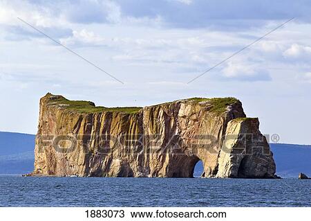 Stock Image - Perce' Rock Photographed From Bonaventure Island; Perce', Quebec, Canada. Fotosearch