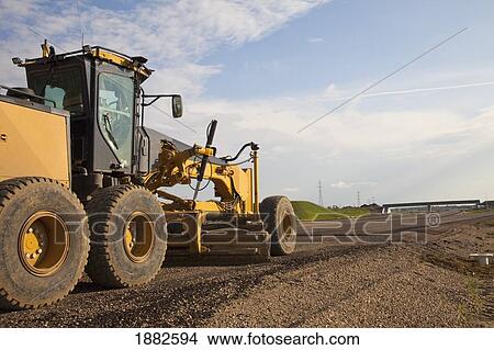 Picture - Road Construction Using A Grader; Edmonton, Alberta, Canada. Fotosearch