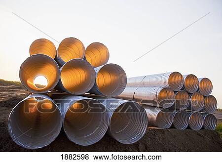 Stock Photo - Stack Of Culvert Pipes; Edmonton, Alberta, Canada. Fotosearch