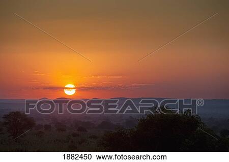 Sunset Over The African Landscape; Manica, Mozambique, Africa View Large Photo Image Stock Image - Sunset Over The African Landscape; Manica, Mozambique, Africa. Fotosearch