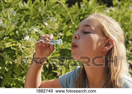 Teen Girl Blowing Bubbles; Benalmadena Costa, Malaga, Andalusia, Spain View Large Photo Image Stock Photo - Teen Girl Blowing Bubbles; Benalmadena Costa, Malaga, Andalusia, Spain. Fotosearch