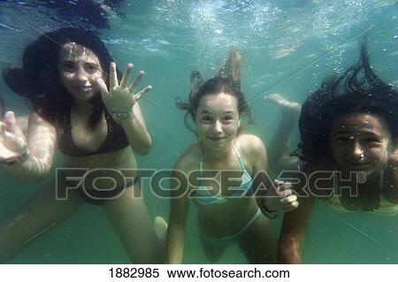 Three Girls Under The Water; Benalmadena Costa, Malaga, Andalusia, Spain View Large Photo Image Stock Photography - Three Girls Under The Water; Benalmadena Costa, Malaga, Andalusia, Spain. Fotosearch