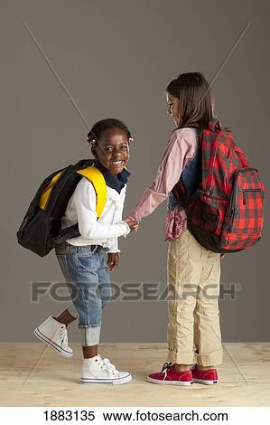 Two Girls With Backpacks Holding Hands View Large Photo Image Stock Photography - Two Girls With Backpacks Holding Hands. Fotosearch