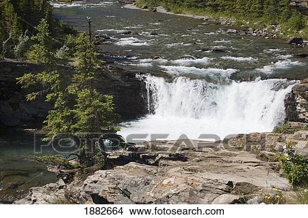 Waterfalls And A Rock Ledge; Alberta, Canada View Large Photo Image Picture - Waterfalls And A Rock Ledge; Alberta, Canada. Fotosearch