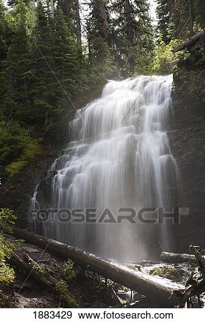Waterfalls Flowing Down A Rock Cliff; Waterton, Alberta, Canada View Large Photo Image Stock Photo - Waterfalls Flowing Down A Rock Cliff; Waterton, Alberta, Canada. Fotosearch