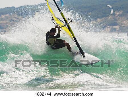 Wind Surfing In The Ocean; Tarifa, Cadiz, Andalusia, Spain View Large Photo Image Picture - Wind Surfing In The Ocean; Tarifa, Cadiz, Andalusia, Spain. Fotosearch