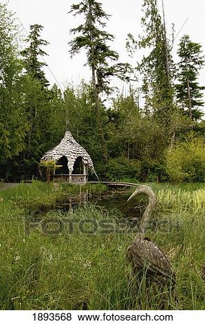 a bird statue and a wooden gazebo; tofino, british columbia, canada View Large Photo Image Stock Photo - a bird statue and a wooden gazebo; tofino, british columbia, canada. Fotosearch
