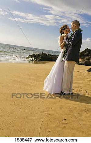 a bride and groom on a beach; maui, hawaii, united states of america View Large Photo Image Stock Photo - a bride and groom on a beach; maui, hawaii, united states of america. Fotosearch