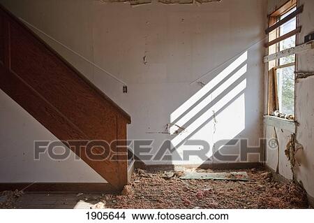 a broken window and debris at the bottom of the stairs inside a building; barrhead, alberta, canada View Large Photo Image Picture - a broken window and debris at the bottom of the stairs inside a building; barrhead, alberta, canada. Fotosearch