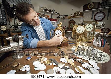 a clock maker and repairman; st. catharines, ontario, canada View Large Photo Image Stock Image - a clock maker and repairman; st. catharines, ontario, canada. Fotosearch