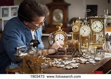 Stock Image - a clock maker and repairman; st. catharines, ontario, canada. Fotosearch
