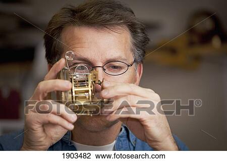 a clock maker and repairman; st. catharines, ontario, canada View Large Photo Image Stock Image - a clock maker and repairman; st. catharines, ontario, canada. Fotosearch