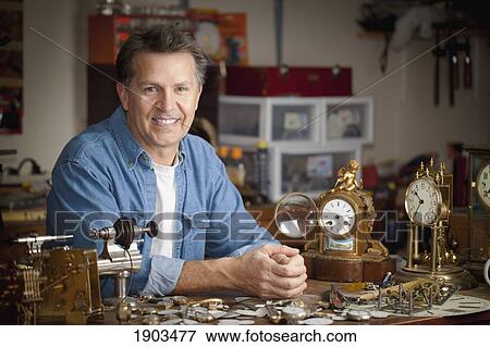 a clock maker and repairman; st. catharines, ontario, canada View Large Photo Image Stock Photo - a clock maker and repairman; st. catharines, ontario, canada. Fotosearch