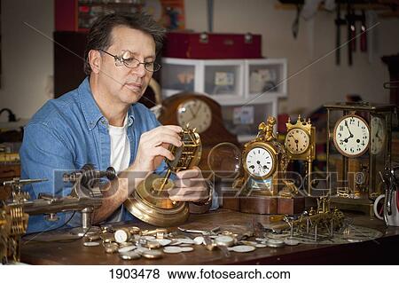 a clock maker and repairman; st. catharines, ontario, canada View Large Photo Image Stock Photo - a clock maker and repairman; st. catharines, ontario, canada. Fotosearch