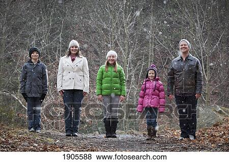 a family portrait in a snowfall; grimsby, ontario, canada View Large Photo Image Stock Photo - a family portrait in a snowfall; grimsby, ontario, canada. Fotosearch