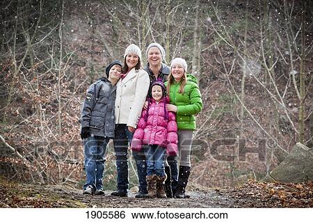 a family portrait in a snowfall; grimsby, ontario, canada View Large Photo Image Stock Photograph - a family portrait in a snowfall; grimsby, ontario, canada. Fotosearch