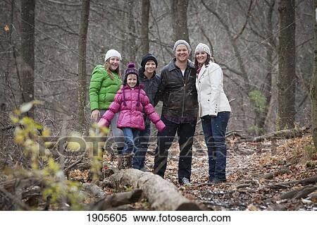 Stock Photography - a family portrait in a snowfall; grimsby, ontario, canada. Fotosearch