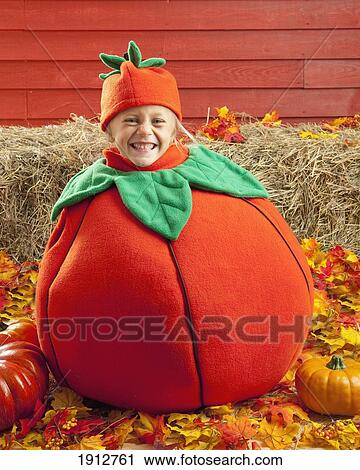 a girl in a pumpkin costume; three hills, alberta, canada View Large Photo Image Stock Image - a girl in a pumpkin costume; three hills, alberta, canada. Fotosearch