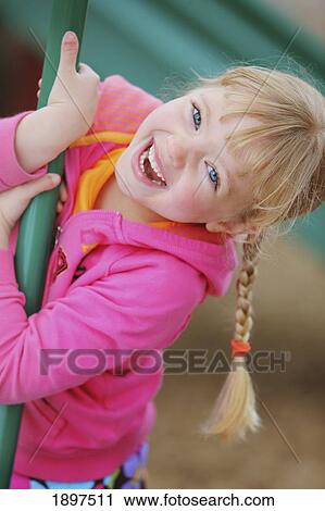 a girl playing on playground equipment; troutdale, oregon, united states of america View Large Photo Image Stock Image - a girl playing on playground equipment; troutdale, oregon, united states of america. Fotosearch