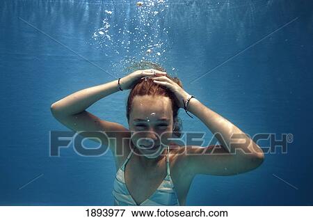 Stock Photo - a girl under the water; tarifa, cadiz, andalusia, spain. Fotosearch