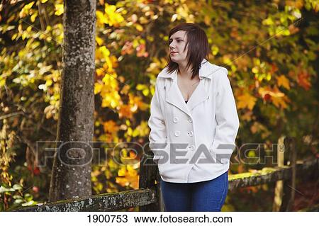 a girl walking along a trail in autumn; portland, oregon, united states of america View Large Photo Image Stock Image - a girl walking along a trail in autumn; portland, oregon, united states of america. Fotosearch