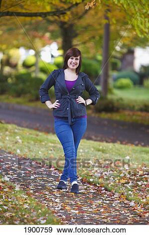 a girl walking along a trail in autumn; portland, oregon, united states of america View Large Photo Image Stock Photo - a girl walking along a trail in autumn; portland, oregon, united states of america. Fotosearch
