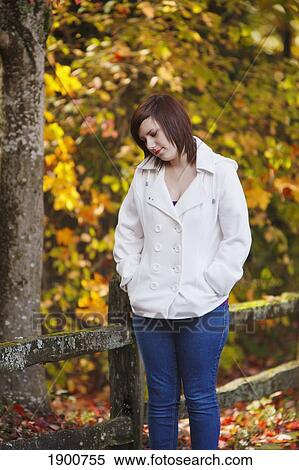 a girl walking along a trail in autumn; portland, oregon, united states of america View Large Photo Image Stock Photography - a girl walking along a trail in autumn; portland, oregon, united states of america. Fotosearch