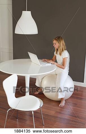a girl wearing white and using a white laptop computer in a room furnished in white; benalamadena costa, malaga, andalusia, spain View Large Photo Image Stock Photography - a girl wearing white and using a white laptop computer in a room furnished in white; benalamadena costa, malaga, andalusia, spain. Fotosearch