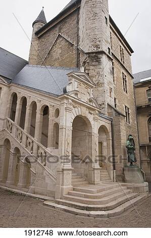 Stock Photo - a historic building with a tower build by belin de comblanchien; beaune, cote d'or, france. Fotosearch