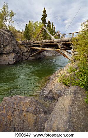 a historic log bridge, frontier bridge; haines junction, yukon territory, canada View Large Photo Image Stock Photo - a historic log bridge, frontier bridge; haines junction, yukon territory, canada. Fotosearch