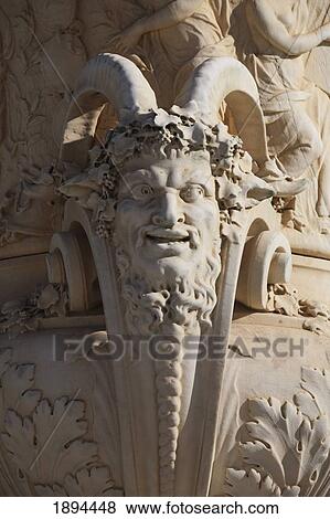 a horned face on a vase handle in the gardens in the palace of versailles; paris, france View Large Photo Image Stock Photo - a horned face on a vase handle in the gardens in the palace of versailles; paris, france. Fotosearch
