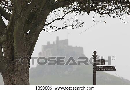 a landmark distance sign and lindisfarne castle; holy island, northumberland, england View Large Photo Image Stock Photography - a landmark distance sign and lindisfarne castle; holy island, northumberland, england. Fotosearch