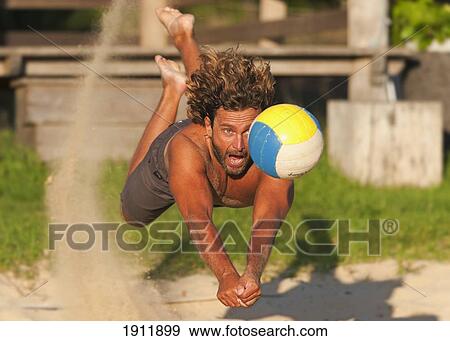 a man diving for a beach ball; tarifa, cadiz, andalusia, spain View Large Photo Image Stock Photo - a man diving for a beach ball; tarifa, cadiz, andalusia, spain. Fotosearch