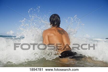 a man jumping into the waves; gold coast, queensland, australia View Large Photo Image Stock Image - a man jumping into the waves; gold coast, queensland, australia. Fotosearch