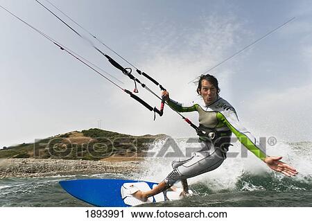 a man kite surfing off the coast of parque natural del estrecho; tarifa, cadiz, andalusia, spain View Large Photo Image Stock Image - a man kite surfing off the coast of parque natural del estrecho; tarifa, cadiz, andalusia, spain. Fotosearch