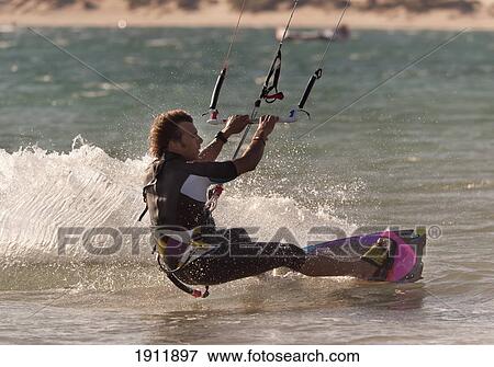 a man kitesurfing; tarifa, cadiz, andalusia, spain View Large Photo Image Stock Photo - a man kitesurfing; tarifa, cadiz, andalusia, spain. Fotosearch