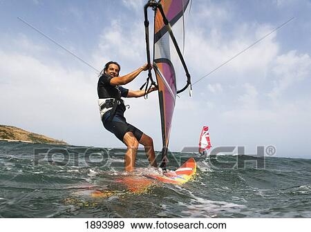 a man surfing off the coast of parque natural del estrecho; tarifa, cadiz, andalusia, spain View Large Photo Image Stock Photo - a man surfing off the coast of parque natural del estrecho; tarifa, cadiz, andalusia, spain. Fotosearch