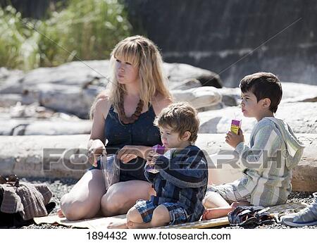 a mother having a picnic with her two sons; victoria, british columbia, canada View Large Photo Image Stock Image - a mother having a picnic with her two sons; victoria, british columbia, canada. Fotosearch