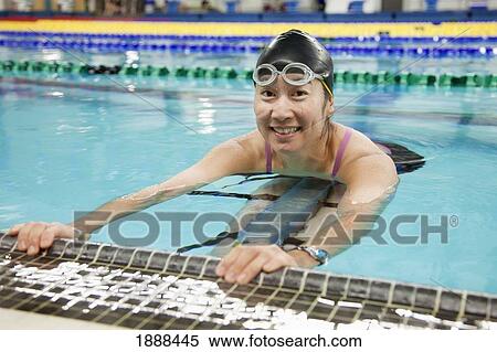 Stock Photography - a paraplegic woman swims in a pool; edmonton, alberta, canada. Fotosearch